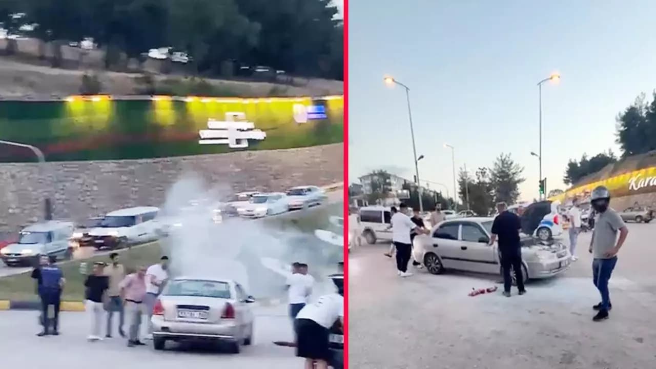 Trafik ışıklarında bekleyen otomobilden dumanlar yükseldi