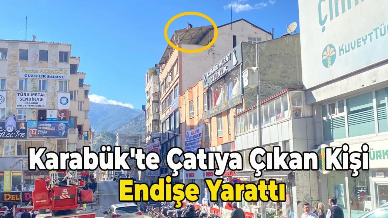Karabük'te Bir Kişi Apartman Çatısından Sarkarken Görüntülendi